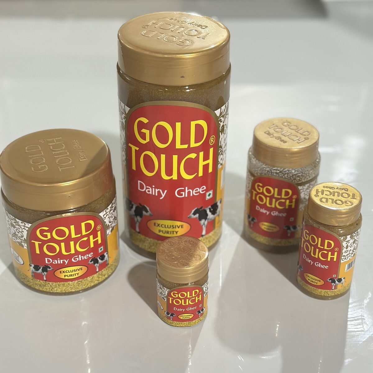 Granular Gold Touch ghee on a spoon, close up